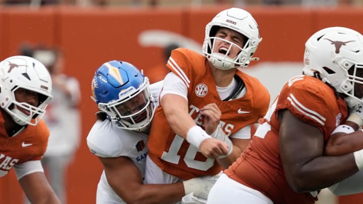Sep 6, 2025; Austin, Texas, USA; Texas Longhorns quarterback Arch Manning (16) reacts after getting hit by San Jose State Spartans linebacker Taniela Latu (4).