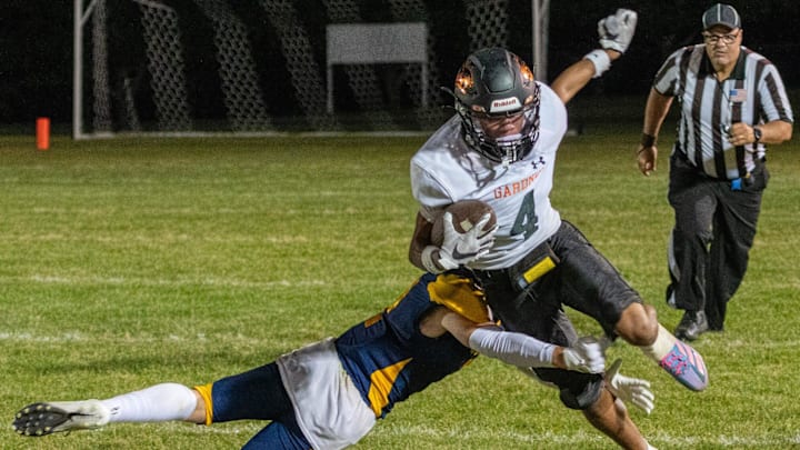Gardner’s Rocco Roy runs through Quabbin’s Quin Reynolds on his way to a second quarter touchdown Thursday. Gardner’s Rocco Roy runs through Quabbin’s Quin Reynolds on his way to a second quarter touchdown Thursday.