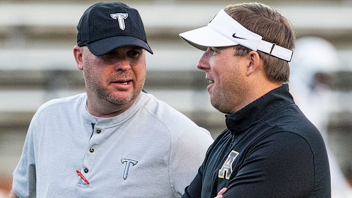 Troy head coach Chip Lindsey and Appalachian State head coach Eliah Drinkwitz chat before their game on the Troy campus in Troy, Ala., on Friday, November 29, 2019.

T01