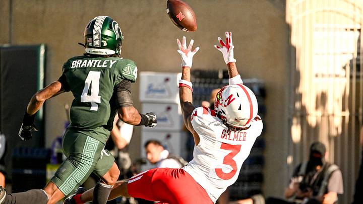 Nebraska wide receiver Kwazi Gilmer makes a diving catch for a touchdown against Michigan State. Nebraska wide receiver Kwazi Gilmer makes a diving catch for a touchdown against Michigan State.
