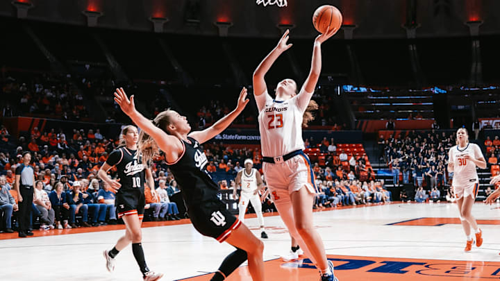 Illinois forward Berry Wallace (23) bounces an Indiana defender under the rim in the Illini's 78-57 win in its Big Ten opener Saturday at State Farm Center in Champaign, Illinois. Illinois forward Berry Wallace (23) bounces an Indiana defender under the rim in the Illini's 78-57 win in its Big Ten opener Saturday at State Farm Center in Champaign, Illinois.