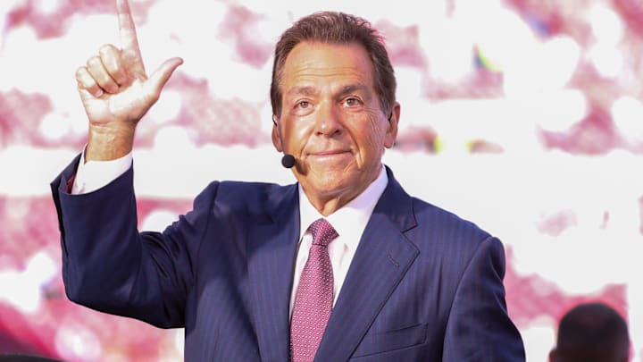 ESPN personality Nick Saban does the Guns Up gesture toward Texas Tech students before a Big 12 Conference football game ESPN personality Nick Saban does the Guns Up gesture toward Texas Tech students before a Big 12 Conference football game