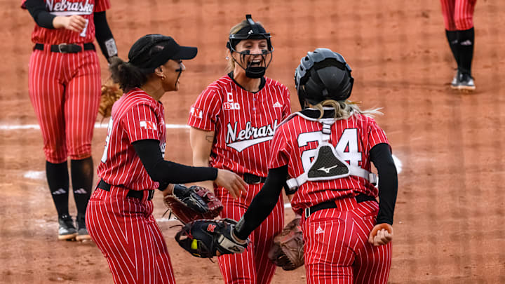 Samantha Bland (left), Jordy Bahl (middle) and Ava Bredwell (24) celebrate Bredwell's diving catch in the infield. Samantha Bland (left), Jordy Bahl (middle) and Ava Bredwell (24) celebrate Bredwell's diving catch in the infield.