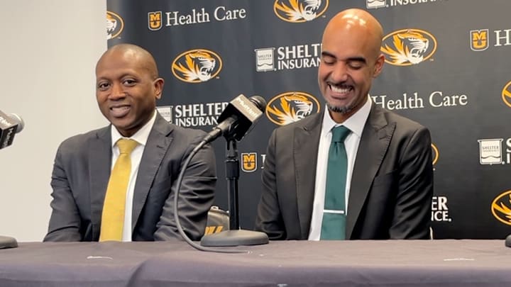 Nov 28, 2025; Columbia, Missouri, USA; Missouri Tigers head coach Dennis Gates and Cleveland State head coach Rob Summers, a former assistant at Missouri, share a smile at Summers' post game press conference following a loss to the Tigers.
