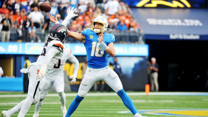 Chargers quarterback Justin Herbert (10) throws a TD pass against the Broncos at SoFi Stadium