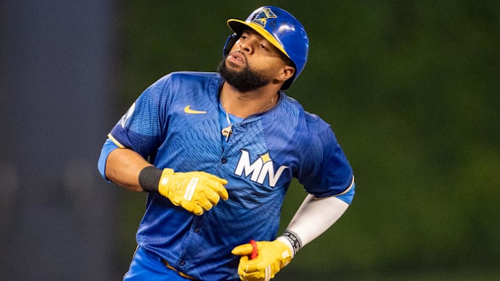 Sep 27, 2024; Minneapolis, Minnesota, USA; Minnesota Twins first baseman Carlos Santana (30) is tagged out on the bases in the ninth inning by Baltimore Orioles third baseman Ramon Urias (29) at Target Field.
