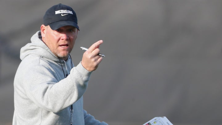 Purdue Boilermakers head coach Barry Odom looks down field 