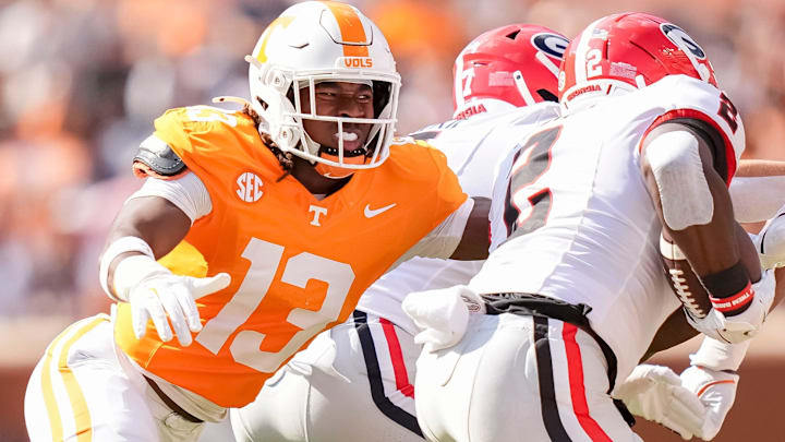 Tennessee linebacker Edwin Spillman (13) chases down Georgia running back Josh McCray (2) during a college football game between Tennessee and Georgia at Neyland Stadium in Knoxville, Tenn., on Sept. 13, 2025.