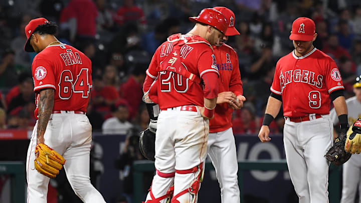 Jun 5, 2019; Anaheim, CA, USA; Los Angeles Angels manager Brad Ausmus (middle right) stands on the