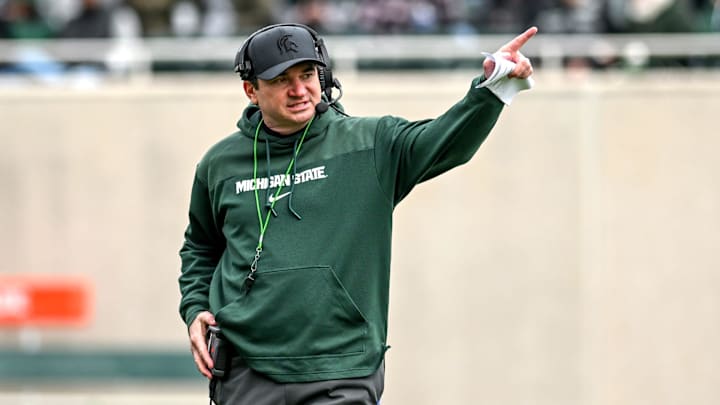 Michigan State's head coach Jonathan Smith communicates with staff on Saturday, April 20, 2024, at Spartan Stadium in East Lansing.