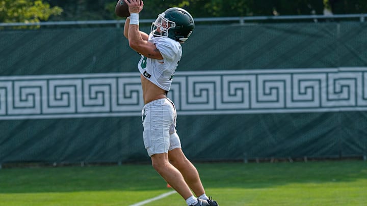 Michigan State's Caleb Gash (15) grabs a pass during practice Tuesday, Aug. 5, 2025.