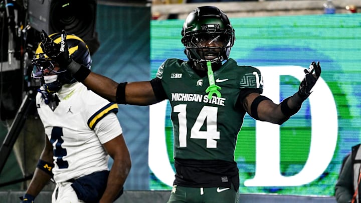 Michigan State's Malcolm Bell, right, reacts after getting called for pass interference against Michigan's Andrew Marsh during the first quarter on Saturday, Oct. 25, 2025, at Spartan Stadium in East Lansing.