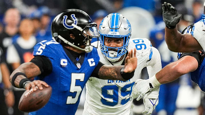 Detroit Lions defensive end Za'Darius Smith (99) pressures Indianapolis Colts quarterback Anthony Richardson (5) during the second half at Lucas Oil Stadium in Indianapolis, Ind. on Sunday, Nov. 24, 2024. Detroit Lions defensive end Za'Darius Smith (99) pressures Indianapolis Colts quarterback Anthony Richardson (5) during the second half at Lucas Oil Stadium in Indianapolis, Ind. on Sunday, Nov. 24, 2024.
