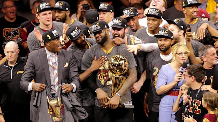 Jun 19, 2016; Oakland, CA, USA; Cleveland Cavaliers forward LeBron James (23) celebrates with the Larry O'Brien Championship Trophy after beating the Golden State Warriors in game seven of the NBA Finals at Oracle Arena. Mandatory Credit: Kelley L Cox-Imagn Images