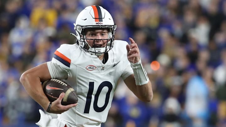 Former Virginia Cavaliers quarterback Anthony Colandrea (10) runs with the ball against the Pittsburgh Panthers during the first quarter at Acrisure Stadium. 