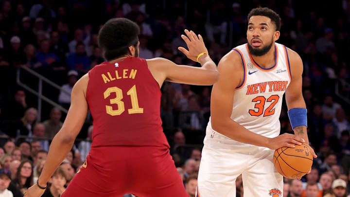 Oct 22, 2025; New York, New York, USA; New York Knicks center Karl-Anthony Towns (32) controls the ball against Cleveland Cavaliers center Jarrett Allen (31) during the fourth quarter at Madison Square Garden. Mandatory Credit: Brad Penner-Imagn Images