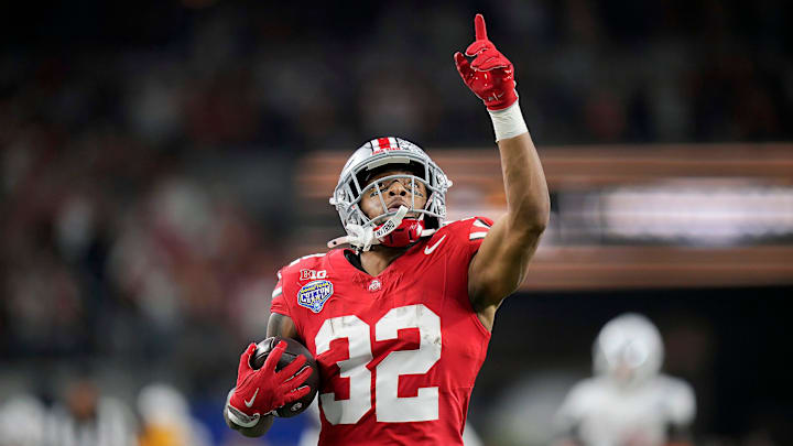 Ohio State Buckeyes running back TreVeyon Henderson (32) scores a touchdown on a 75-yard touchdown catch and run against Texas Longhorns in the second quarter of the Cotton Bowl Classic during the College Football Playoff semifinal game at AT&T Stadium in Arlington, Texas on January, 10, 2025.