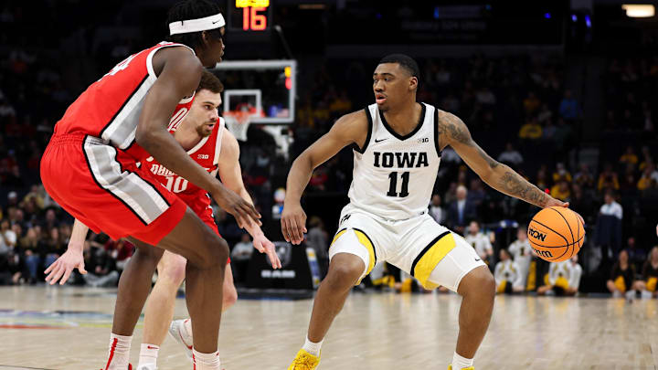 Mar 14, 2024; Minneapolis, MN, USA; Iowa Hawkeyes guard Tony Perkins (11) dribbles as Ohio State