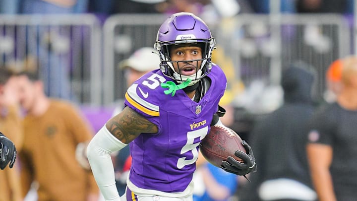 Nov 12, 2023; Minneapolis, Minnesota, USA; Minnesota Vikings cornerback Mekhi Blackmon (5) intercepts the ball against the New Orleans Saints in the fourth quarter at U.S. Bank Stadium. 