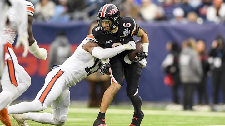 Dec 30, 2023; Nashville, TN, USA; Auburn Tigers linebacker Cam Riley (13) tackles Maryland Terrapins