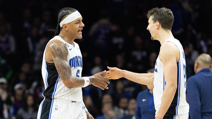 Orlando Magic forward Paolo Banchero (5) and forward Franz Wagner (22) celebrate a score against the Philadelphia 76ers during the fourth quarter at Wells Fargo Center.