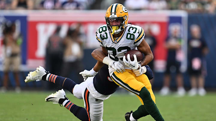 Sep 10, 2023; Chicago, Illinois, USA;  Green Bay Packers wide receiver Samori Toure (83) runs for a gain as Chicago Bears linebacker T.J. Edwards (53) hangs on for the tackle in the second half at Soldier Field.
