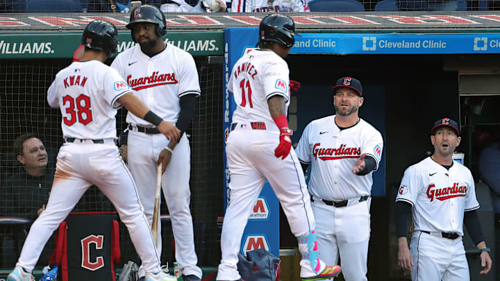 Guardians manager Stephen Vogt congratulates José Ramírez (11) after his two-run homer during the fifth inning of the home opener against the Chicago White Sox, Monday, April 8, 2024.