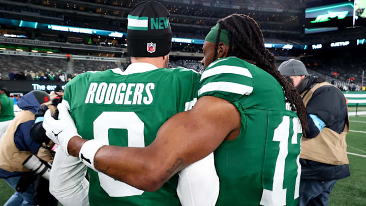 Jan 5, 2025; East Rutherford, New Jersey, USA; New York Jets quarterback Aaron Rodgers (8) and wide receiver Davante Adams (17) walk on the field after the Jets win over the Miami Dolphins at MetLife Stadium. Mandatory Credit: Ed Mulholland-Imagn Images