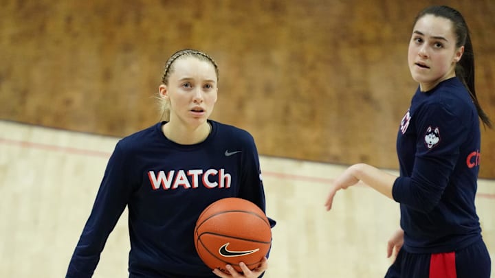 Mar 1, 2021; Storrs, Connecticut, USA; UConn Huskies guard Paige Bueckers (5) (left) and guard Nika Muhl (right) warm up before a game against the Marquette Golden Eagles at Harry A. Gampel Pavilion. Mandatory Credit: David Butler II-Imagn Images