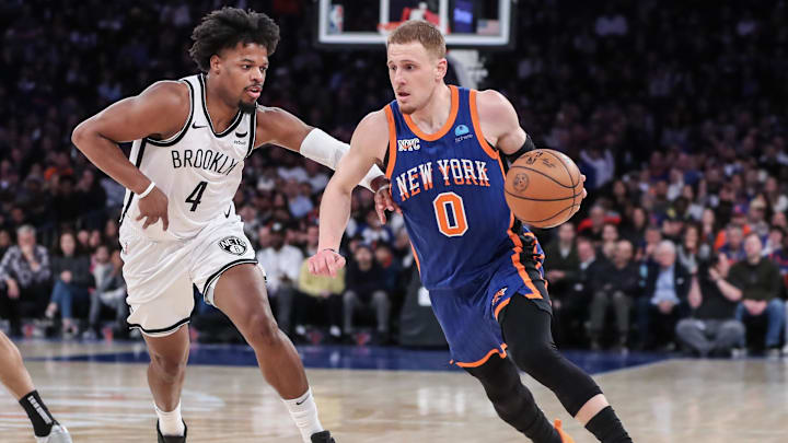 Mar 23, 2024; New York, New York, USA: New York Knicks guard Donte DiVincenzo (0) looks to drive past Brooklyn Nets guard Dennis Smith Jr. (4) in the fourth quarter at Madison Square Garden. Mandatory Credit: Wendell Cruz-Imagn Images Mar 23, 2024; New York, New York, USA: New York Knicks guard Donte DiVincenzo (0) looks to drive past Brooklyn Nets guard Dennis Smith Jr. (4) in the fourth quarter at Madison Square Garden. Mandatory Credit: Wendell Cruz-Imagn Images