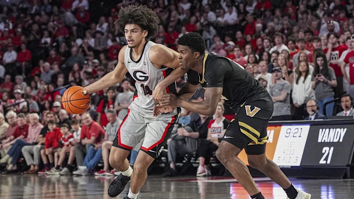 Mar 8, 2025; Athens, Georgia, USA; Georgia Bulldogs forward Asa Newell (14) dribbles against Vanderbilt Commodores forward JaQualon Roberts (24) during the first half at Stegeman Coliseum. Mandatory Credit: Dale Zanine-Imagn Images