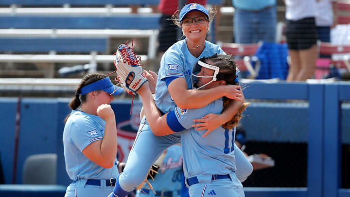 Kansas' Lizzy Ludwig (11) and Katie Brooks (16) celebrate their win over Oklahoma State following the Big 12 softball tournament game between the Oklahoma State Cowgirls and the Kansas Jayhawks at USA Softball Hall of Fame Stadium in Oklahoma City, Friday, May, 12, 2023.