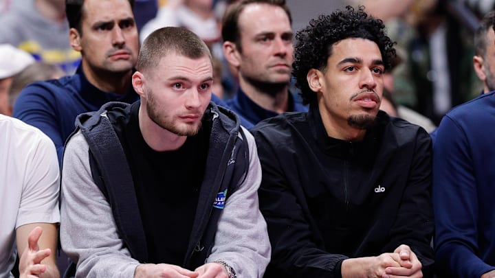 Nov 28, 2025; Denver, Colorado, USA; Denver Nuggets guard Christian Braun (0) and guard Julian Strawther (3) on the bench in the fourth quarter against the San Antonio Spurs at Ball Arena. Mandatory Credit: Isaiah J. Downing-Imagn Images