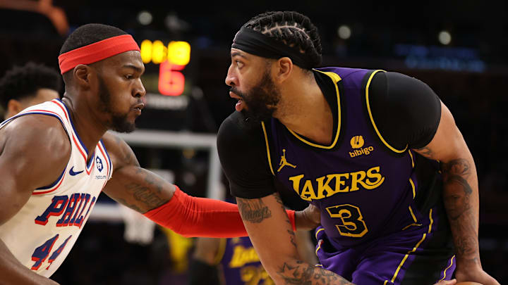 Mar 22, 2024; Los Angeles, California, USA;  Los Angeles Lakers forward Anthony Davis (3) posts up against Philadelphia 76ers forward Paul Reed (44) during the fourth quarter at Crypto.com Arena. Mandatory Credit: Kiyoshi Mio-Imagn Images