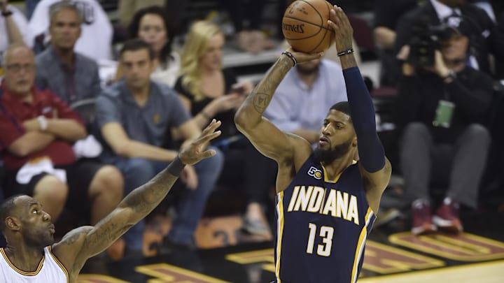 Apr 15, 2017; Cleveland, OH, USA; iIndiana Pacers forward Paul George (13) shoots against Cleveland Cavaliers forward LeBron James (23) in the first quarter in game one of the first round of the 2017 NBA Playoffs at Quicken Loans Arena. Mandatory Credit: David Richard-Imagn Images