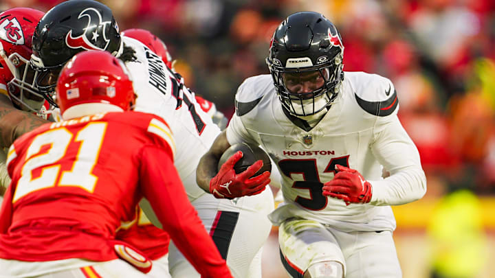 Jan 18, 2025; Kansas City, Missouri, USA; Houston Texans running back Dameon Pierce (31) runs the ball against Kansas City Chiefs safety Jaden Hicks (21) during the second half in a 2025 AFC divisional round game at GEHA Field at Arrowhead Stadium. Mandatory Credit: Jay Biggerstaff-Imagn Images Jan 18, 2025; Kansas City, Missouri, USA; Houston Texans running back Dameon Pierce (31) runs the ball against Kansas City Chiefs safety Jaden Hicks (21) during the second half in a 2025 AFC divisional round game at GEHA Field at Arrowhead Stadium. Mandatory Credit: Jay Biggerstaff-Imagn Images