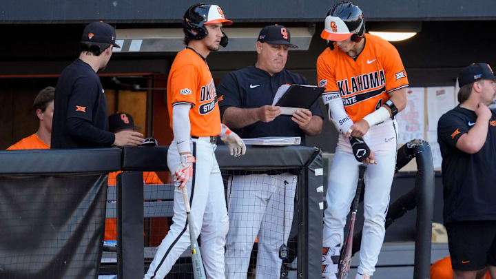 Oklahoma State coach Josh Holiday talks with Brayden Smith, right, and Drew Culbertson during a college Bedlam baseball game between the University of Oklahoma Sooners (OU) and the Oklahoma State University Cowboys (OSU) at O'Brate Stadium in Stillwater, Okla., Tuesday, April 15, 2025.
