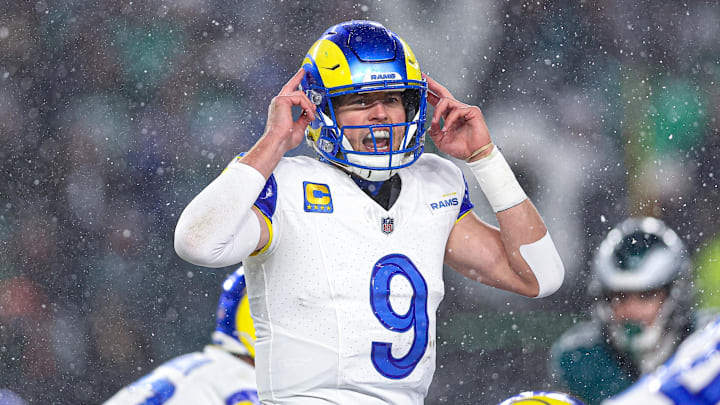 Jan 19, 2025; Philadelphia, Pennsylvania, USA; Los Angeles Rams quarterback Matthew Stafford (9) calls a play at the one of scrimmage against the Philadelphia Eagles in a 2025 NFC divisional round game at Lincoln Financial Field. Mandatory Credit: Bill Streicher-Imagn Images