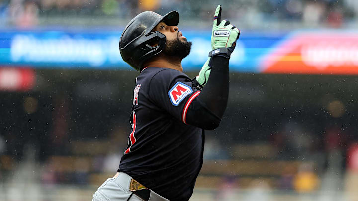 May 21, 2025; Minneapolis, Minnesota, USA; Cleveland Guardians first baseman Carlos Santana (41) celebrates as he runs the bases after hitting a solo home run against the Minnesota Twins in the fourth inning during game one of a doubleheader at Target Field. Mandatory Credit: Matt Krohn-Imagn Images