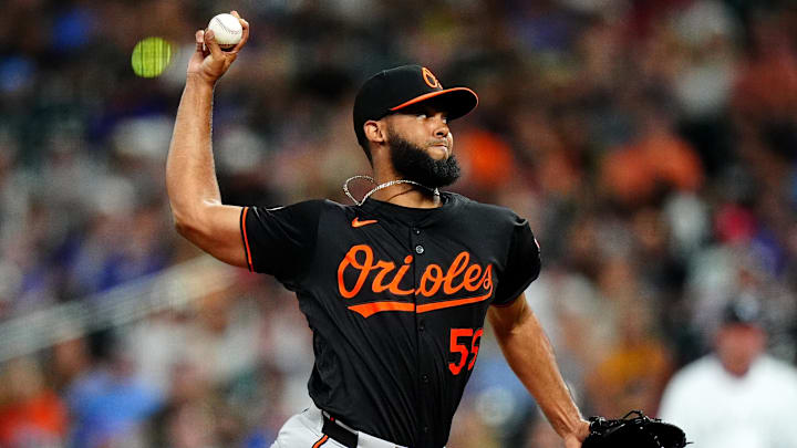Aug 30, 2024; Denver, Colorado, USA; Baltimore Orioles relief pitcher Seranthony Dominguez (56) delivers a pitch in the ninth inning against the Colorado Rockies at Coors Field