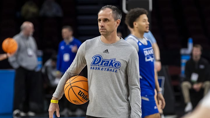 Mar 19, 2025; Wichita, KS, USA; Drake Bulldogs head coach Ben McCollum watches his team during a practice session at Intrust Bank Arena.