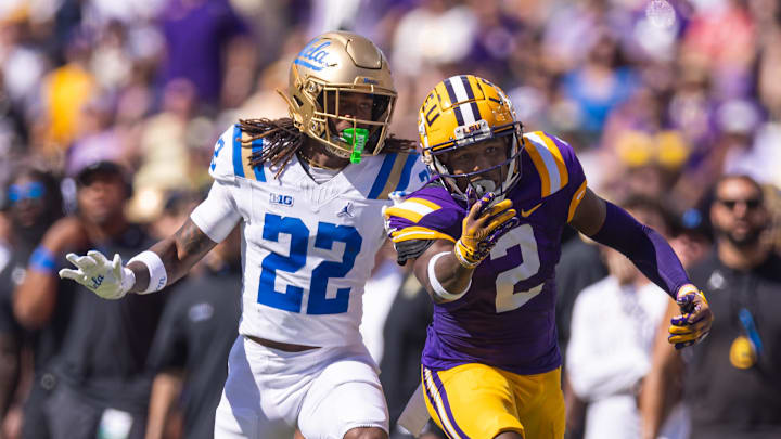 Sep 21, 2024; Baton Rouge, Louisiana, USA;  LSU Tigers wide receiver Kyren Lacy (2) misses a pass against UCLA Bruins defensive back Croix Stewart (22) during the first half at Tiger Stadium. Mandatory Credit: Stephen Lew-Imagn Images