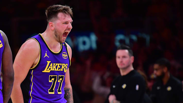 Feb 25, 2025; Los Angeles, California, USA; Los Angeles Lakers guard Luka Doncic (77) reacts against the Dallas Mavericks during the first quarter at Crypto.com Arena. Mandatory Credit: Gary A. Vasquez-Imagn Images