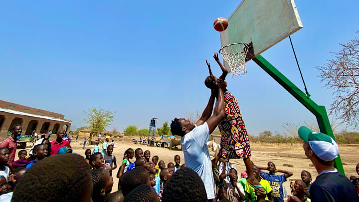 Mady Sissoko assists on a basket at the school he funded Mady Sissoko assists on a basket at the school he funded