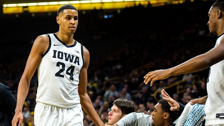 Iowa forward Kris Murray (24) high-fives teammates during a NCAA men's basketball game against