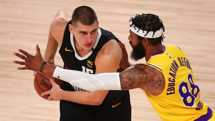 Sep 24, 2020; Lake Buena Vista, Florida, USA; Denver Nuggets center Nikola Jokic (15) controls the ball Los Angeles Lakers forward Markieff Morris (88) during the second half in game four of the Western Conference Finals of the 2020 NBA Playoffs at AdventHealth Arena. Mandatory Credit: Kim Klement-Imagn Images Sep 24, 2020; Lake Buena Vista, Florida, USA; Denver Nuggets center Nikola Jokic (15) controls the ball Los Angeles Lakers forward Markieff Morris (88) during the second half in game four of the Western Conference Finals of the 2020 NBA Playoffs at AdventHealth Arena. Mandatory Credit: Kim Klement-Imagn Images
