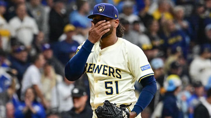 Oct 14, 2025; Milwaukee, Wisconsin, USA; Milwaukee Brewers pitcher Freddy Peralta (51) reacts after giving up a solo home run to Los Angeles Dodgers right fielder Teoscar Hernandez (not pictured) in the second inning during game two of the NLCS round for the 2025 MLB playoffs at American Family Field. Mandatory Credit: Benny Sieu-Imagn Images Oct 14, 2025; Milwaukee, Wisconsin, USA; Milwaukee Brewers pitcher Freddy Peralta (51) reacts after giving up a solo home run to Los Angeles Dodgers right fielder Teoscar Hernandez (not pictured) in the second inning during game two of the NLCS round for the 2025 MLB playoffs at American Family Field. Mandatory Credit: Benny Sieu-Imagn Images