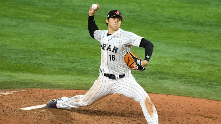 Mar 21, 2023; Miami, Florida, USA; Japan relief pitcher Shohei Ohtani (16) delivers a pitch during the ninth inning against the USA at LoanDepot Park. Mandatory Credit: Sam Navarro-Imagn Images