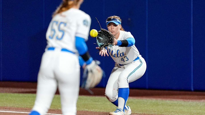 UCLA utility Megan Grant (43) forces out a runner at first base in the first inning during a softball game between UCLA and Oregon at the Women’s College World Series at Devon Park in Oklahoma City, on Thursday, May 29, 2025.