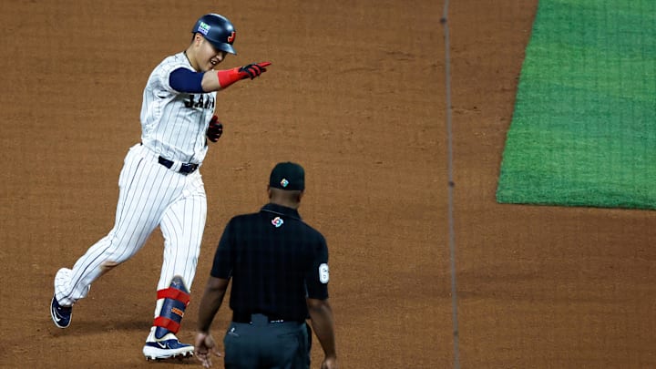 Mar 21, 2023; Miami, Florida, USA; Japan first baseman Kazuma Okamoto (25) celebrates his home run against the USA in the fourth inning at LoanDepot Park. Mandatory Credit: Rhona Wise-Imagn Images Mar 21, 2023; Miami, Florida, USA; Japan first baseman Kazuma Okamoto (25) celebrates his home run against the USA in the fourth inning at LoanDepot Park. Mandatory Credit: Rhona Wise-Imagn Images